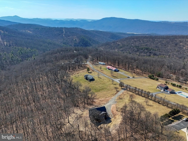 bird's eye view featuring a rural view, a mountain view, and a view of trees