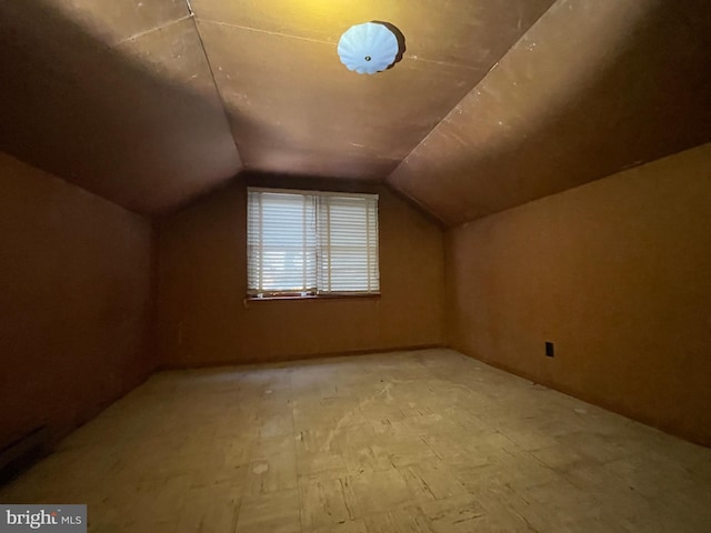 bonus room featuring vaulted ceiling