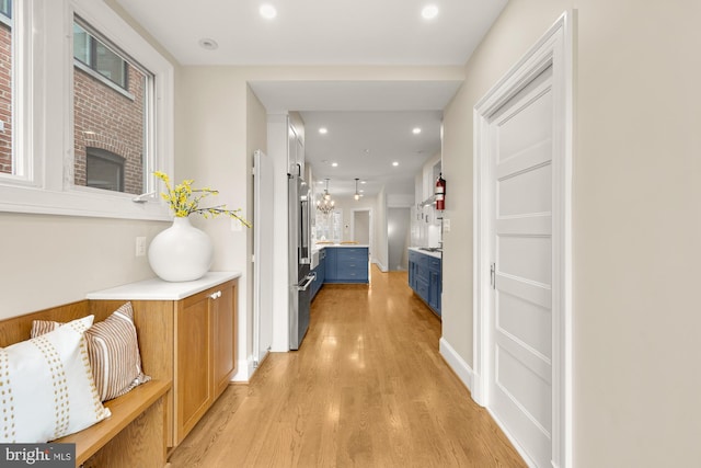 hallway with recessed lighting and light wood-style floors