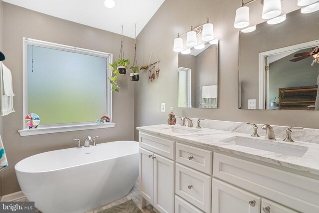7721 Sullivan Cir, Alexandria, VA 22315 - full bath with a freestanding tub, a sink, and double vanity