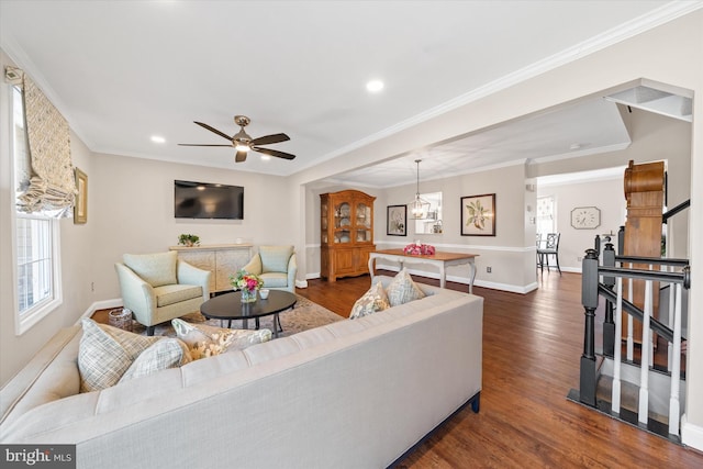 living room with crown molding, dark wood-type flooring, baseboards, ceiling fan, and recessed lighting