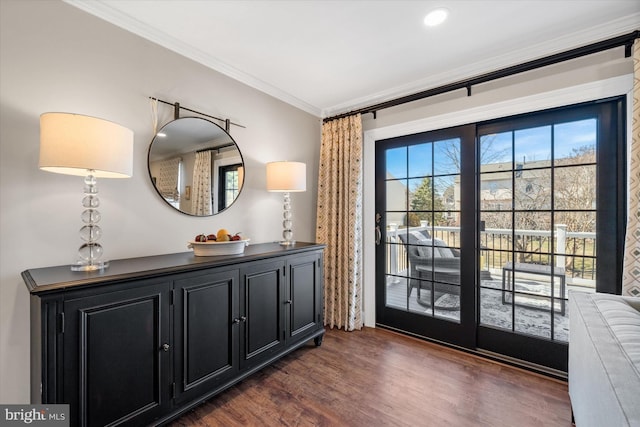 interior space featuring crown molding and dark wood-type flooring