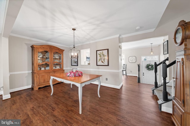 dining space featuring dark wood finished floors, stairway, and baseboards