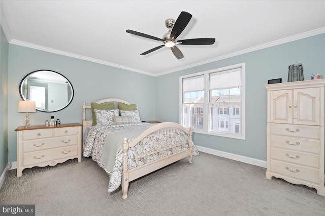 bedroom with ceiling fan, baseboards, carpet, and ornamental molding