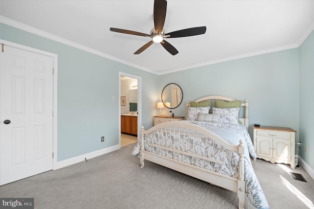 carpeted bedroom with baseboards, a ceiling fan, ensuite bathroom, and crown molding