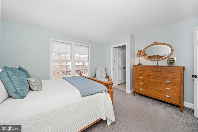 bedroom featuring baseboards and carpet floors