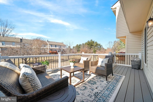 wooden terrace with outdoor lounge area