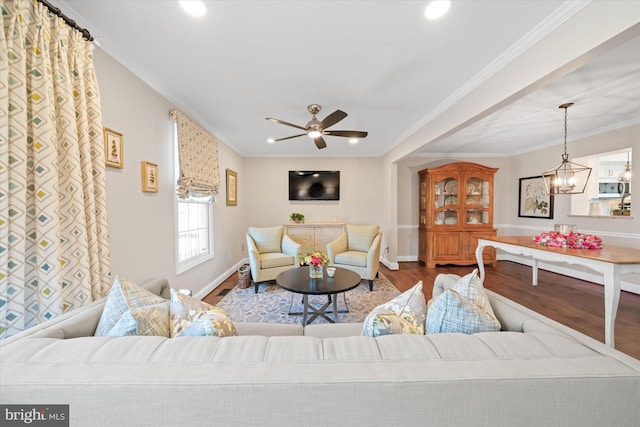 living room featuring crown molding, recessed lighting, wood finished floors, and baseboards