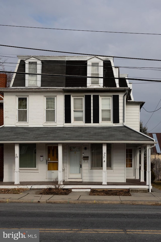 view of property featuring covered porch