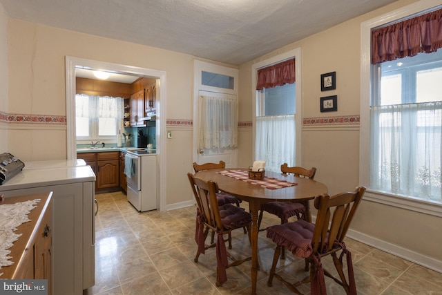 dining room with a wainscoted wall