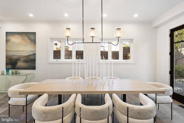 dining space featuring recessed lighting and ornamental molding