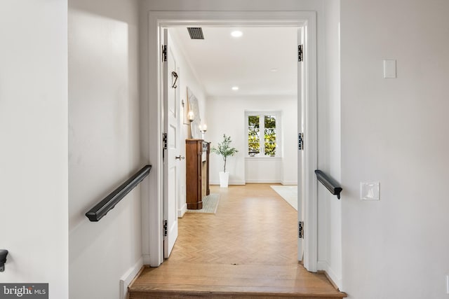 corridor with visible vents, recessed lighting, and baseboards