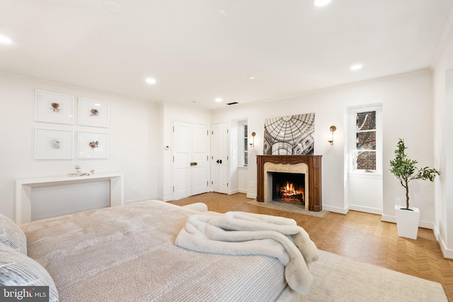 bedroom with recessed lighting, baseboards, and a fireplace with flush hearth