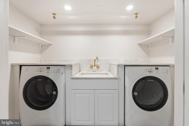 washroom featuring washer / dryer, recessed lighting, and a sink