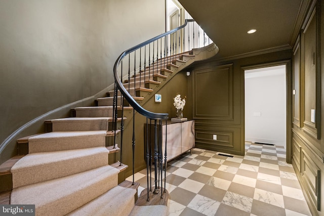 stairway featuring visible vents, baseboards, ornamental molding, recessed lighting, and tile patterned floors