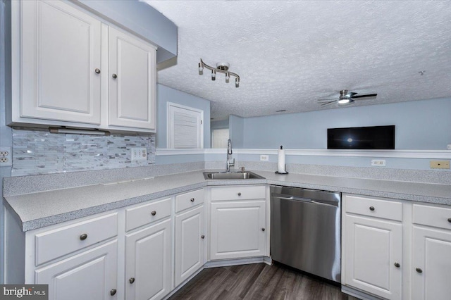 kitchen featuring dishwasher, light countertops, a ceiling fan, and a sink