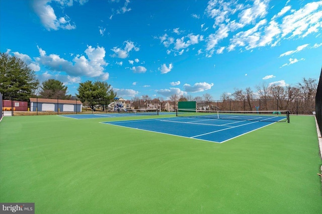 view of tennis court with fence