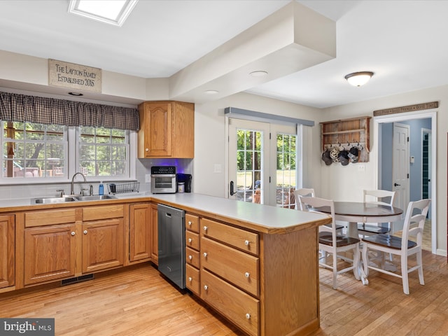 2446 Saint Lukes Rd, Salisbury, MD 21804 - kitchen with a sink, dishwasher, a peninsula, and light wood-type flooring