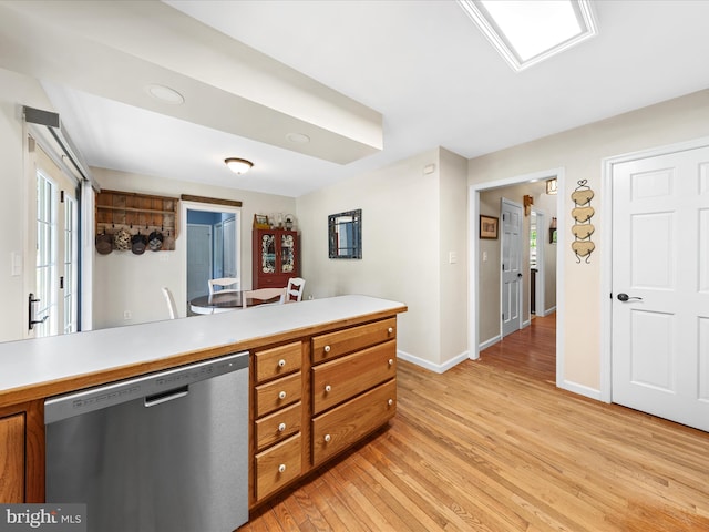 2446 Saint Lukes Rd, Salisbury, MD 21804 - kitchen featuring stainless steel dishwasher, brown cabinets, baseboards, light countertops, and light wood-style floors
