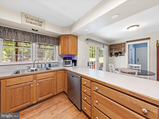 2446 Saint Lukes Rd, Salisbury, MD 21804 - kitchen with stainless steel dishwasher, a sink, light wood-style floors, light countertops, and recessed lighting