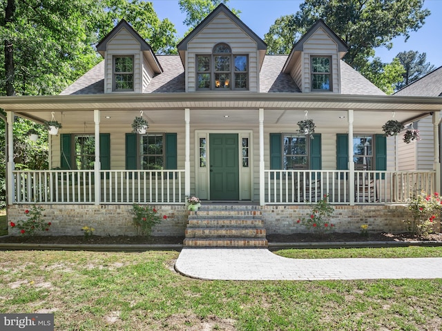 2446 Saint Lukes Rd, Salisbury, MD 21804 - view of front of home with a porch, roof with shingles, and a front yard