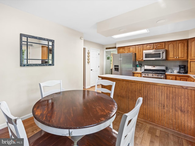 2446 Saint Lukes Rd, Salisbury, MD 21804 - dining area with light wood finished floors and baseboards