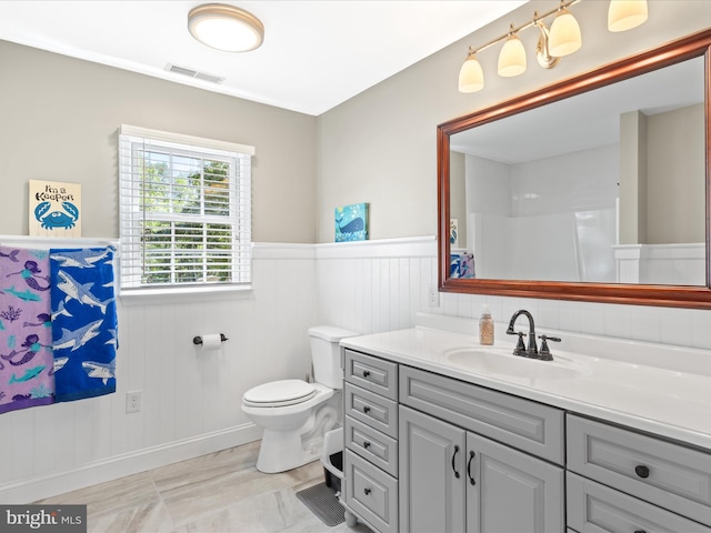 2446 Saint Lukes Rd, Salisbury, MD 21804 - bathroom with wainscoting, vanity, and toilet