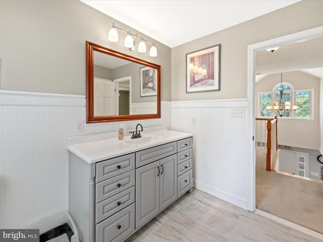 2446 Saint Lukes Rd, Salisbury, MD 21804 - bathroom with wainscoting, a chandelier, and vanity