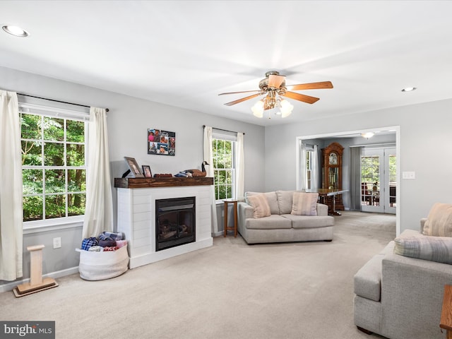 2446 Saint Lukes Rd, Salisbury, MD 21804 - carpeted living area featuring a ceiling fan, a glass covered fireplace, french doors, recessed lighting, and baseboards