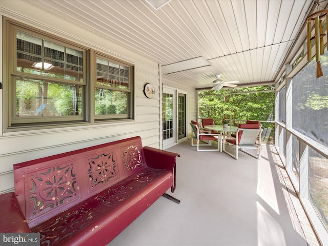 2446 Saint Lukes Rd, Salisbury, MD 21804 - sunroom / solarium with ceiling fan, outdoor dining space, and carpet floors