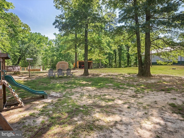 2446 Saint Lukes Rd, Salisbury, MD 21804 - view of yard featuring a storage unit, an outdoor structure, and a playground