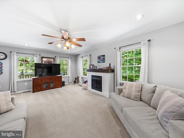 2446 Saint Lukes Rd, Salisbury, MD 21804 - living room with a ceiling fan, light colored carpet, a glass covered fireplace, recessed lighting, and baseboards