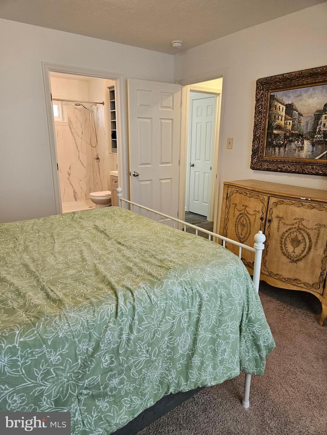 carpeted bedroom with ensuite bath