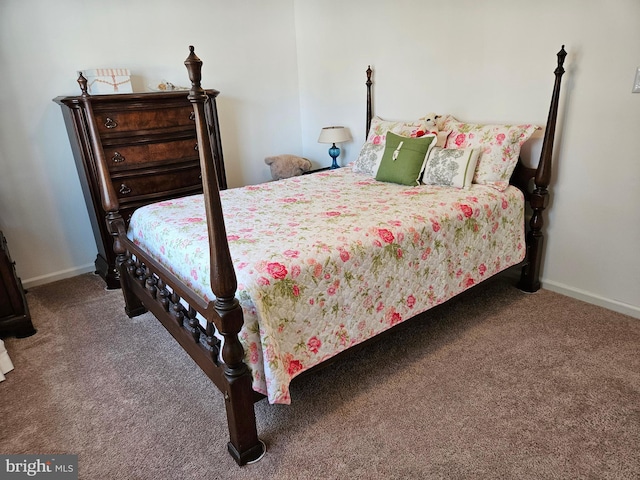 carpeted bedroom featuring baseboards