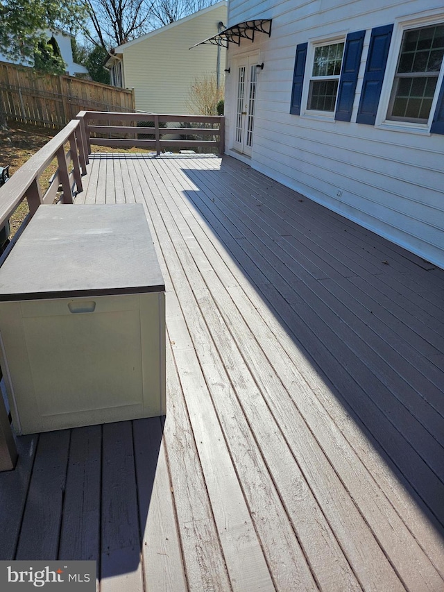 wooden deck with french doors and fence