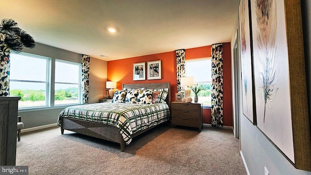 bedroom with visible vents, baseboards, and carpet floors