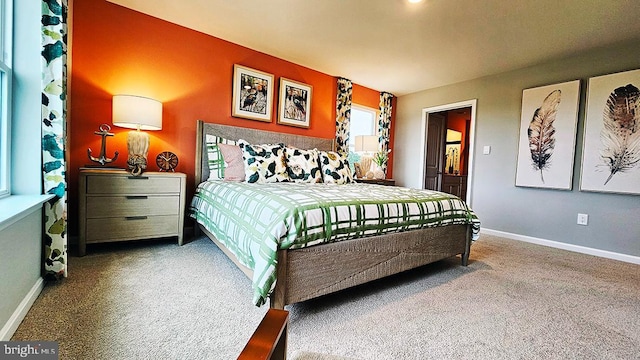 carpeted bedroom with baseboards