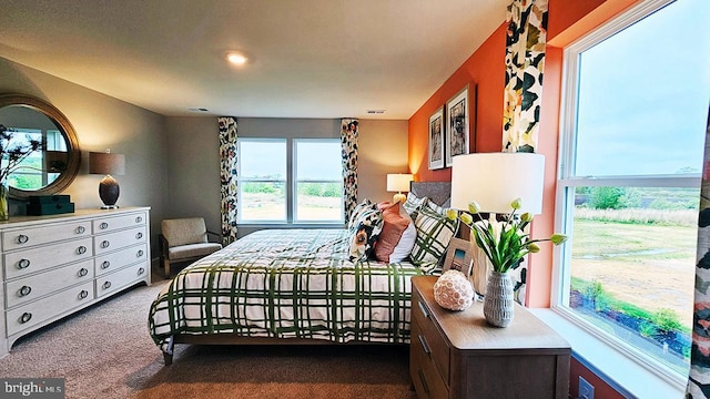 carpeted bedroom with visible vents