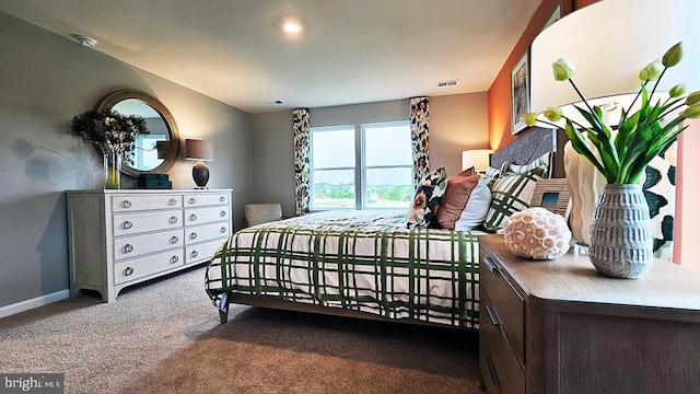 bedroom with carpet flooring, visible vents, and baseboards