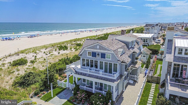 drone / aerial view with a view of the beach and a water view