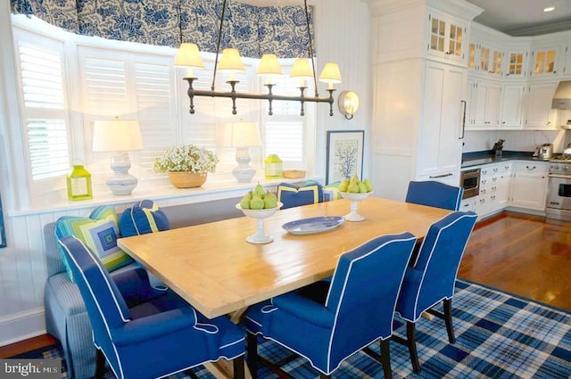 1 103rd St, Stone Harbor, NJ 08247 - dining room featuring dark wood-type flooring, crown molding, and a healthy amount of sunlight