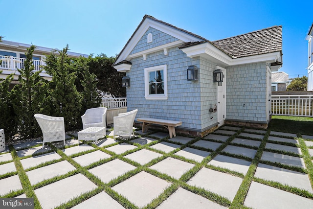 1 103rd St, Stone Harbor, NJ 08247 - back of property featuring a patio area and fence