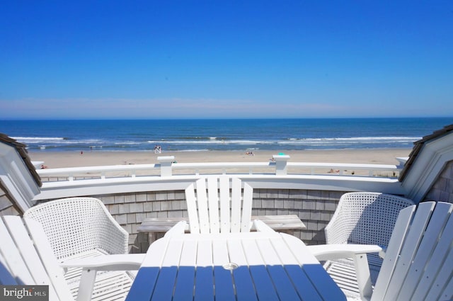 balcony with a view of the beach and a water view