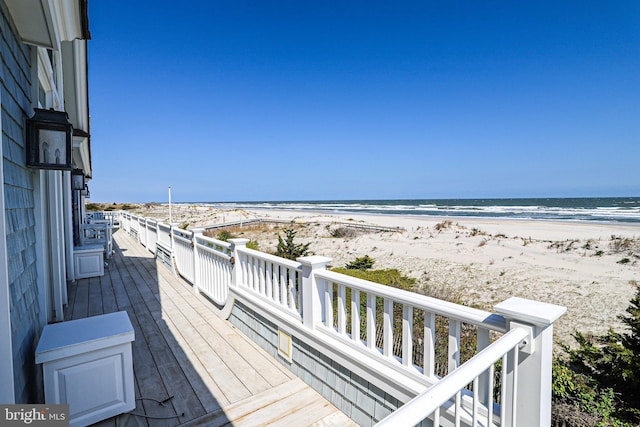 1 103rd St, Stone Harbor, NJ 08247 - wooden terrace featuring a water view and a beach view