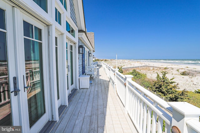1 103rd St, Stone Harbor, NJ 08247 - wooden deck featuring a view of the beach and a water view