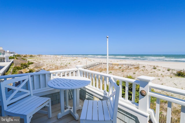 1 103rd St, Stone Harbor, NJ 08247 - wooden deck featuring a view of the beach and a water view
