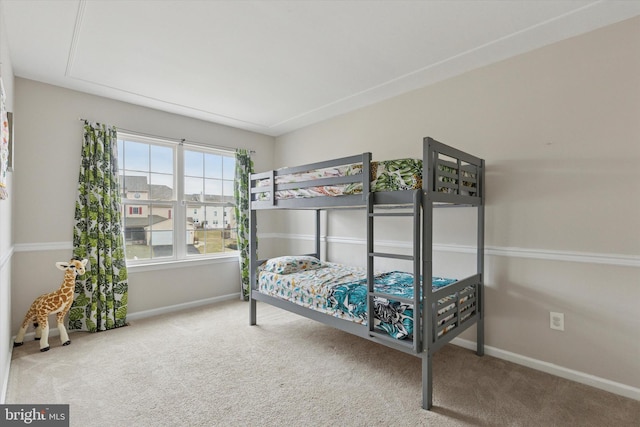 carpeted bedroom with baseboards