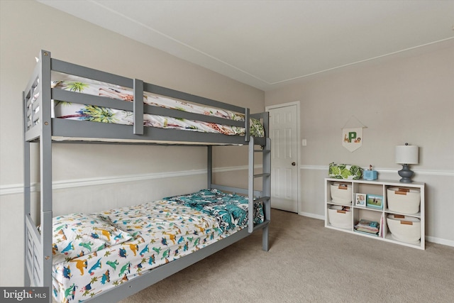 carpeted bedroom with baseboards