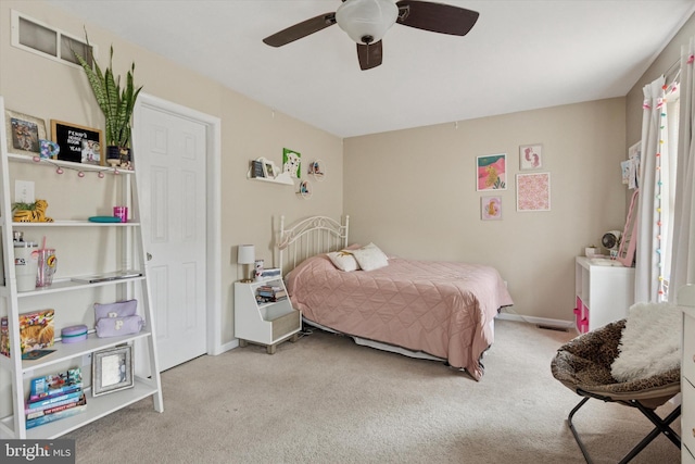 bedroom with carpet flooring, baseboards, and ceiling fan