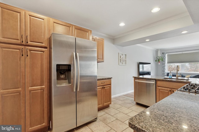 kitchen with ornamental molding, a sink, dark countertops, recessed lighting, and stainless steel appliances